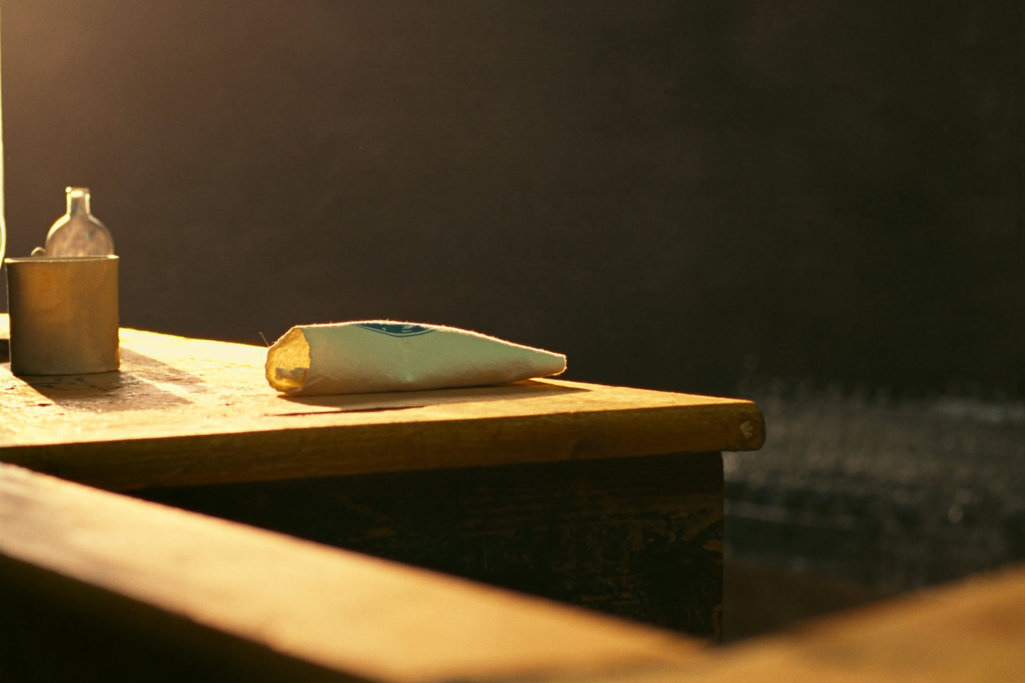 Warm afternoon light on a quiet counter inside a small shop